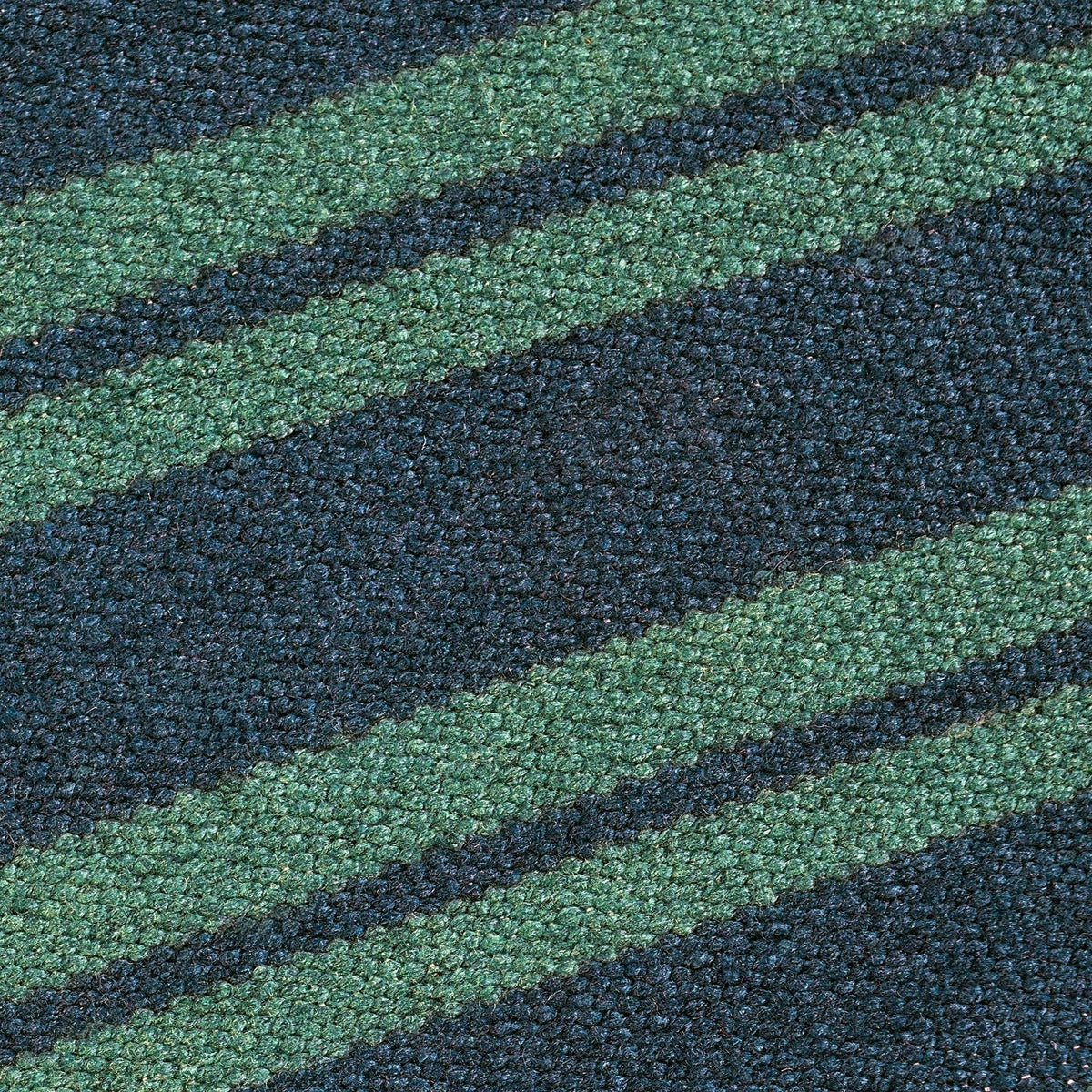 Striped rug surface close-up with blue and green horizontal bands