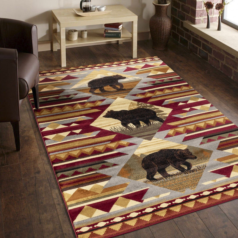 Red, cream, and gray lodge area rug with repeating bear squares and geometric trim