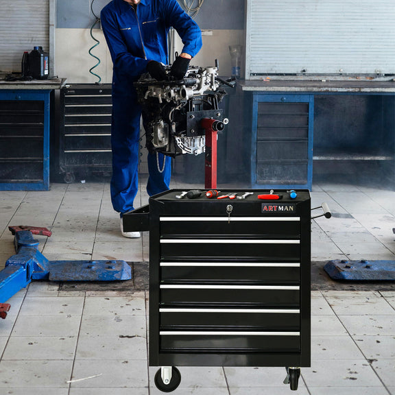 Black tool cart with stacked drawers on four casters, shown in a workshop