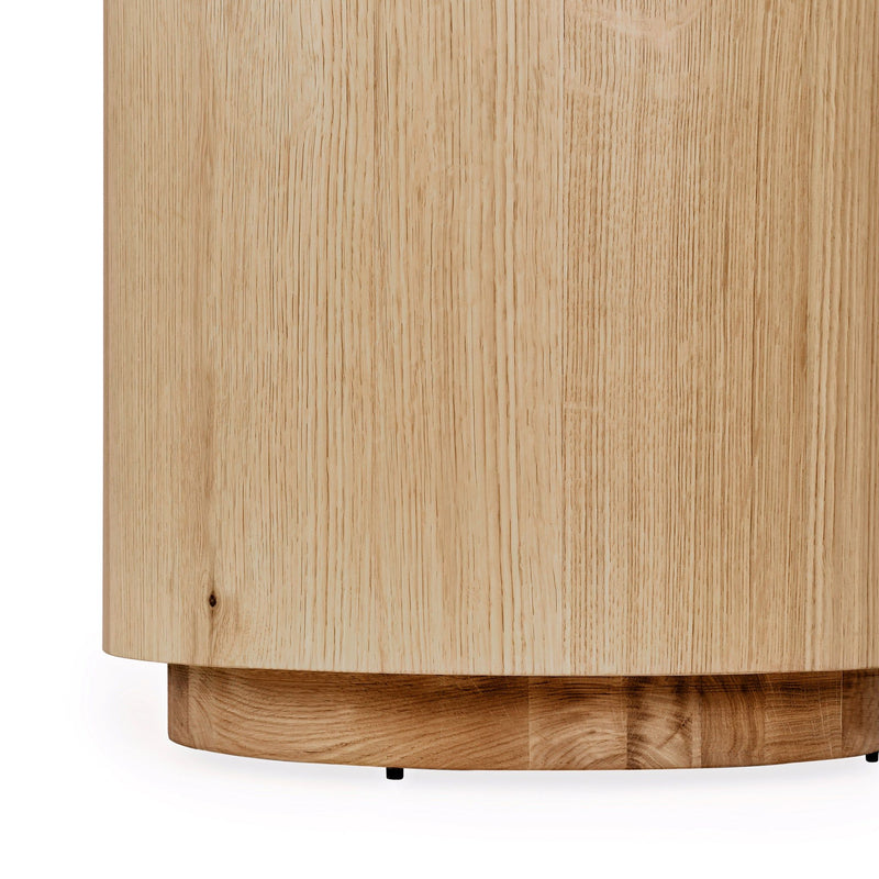 Round end table side view with natural wood finish and dark base trim