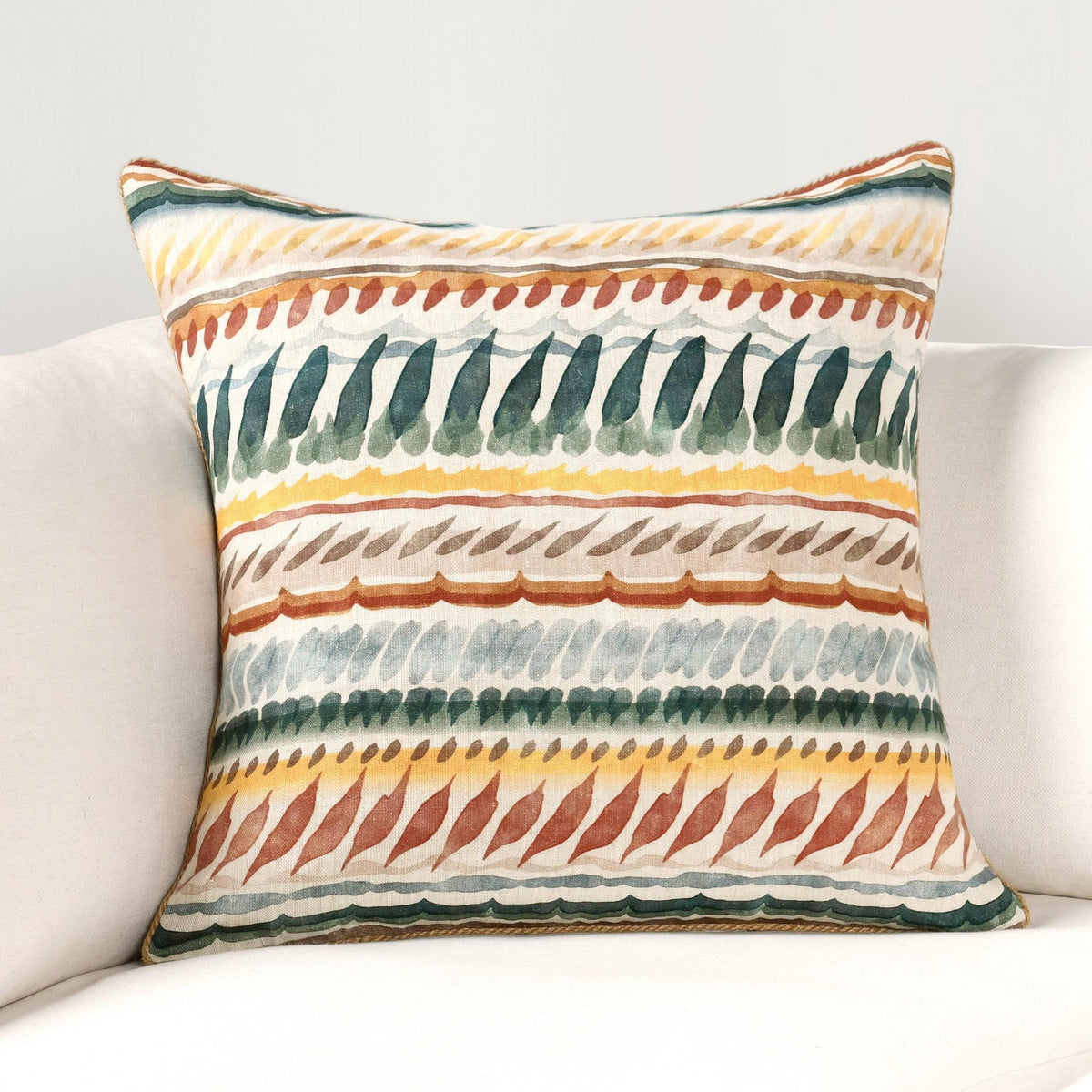 Multicolor striped throw pillow with teal and orange bands on cream background, piped corners
