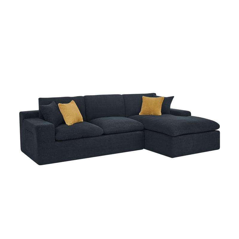 Dark gray sectional sofa with chaise and mustard accent pillows, shown from the side