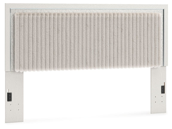 Upholstered panel headboard with white ribbed fabric and light frame, wide vertical panel