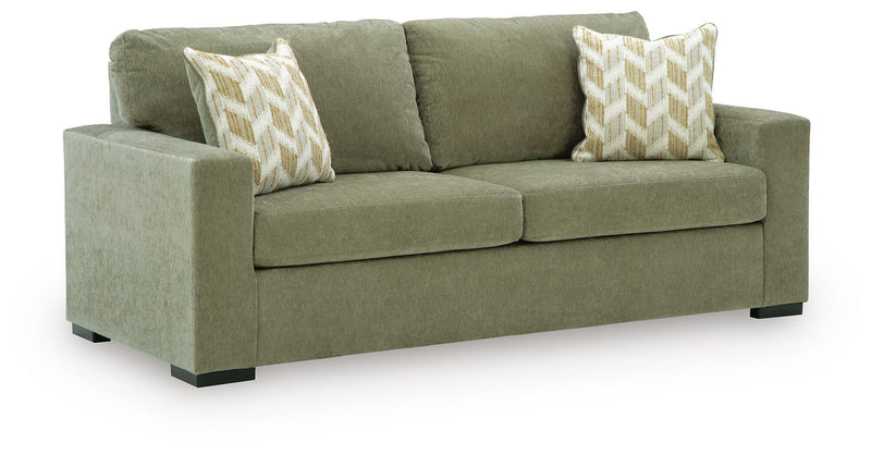 Bridgepoint sofa in green fabric with two seat cushions and two patterned throw pillows