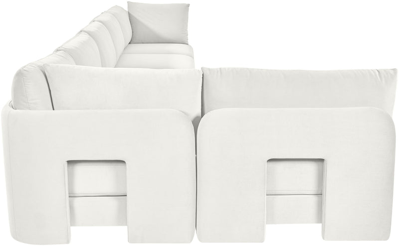 White armless sectional sofa with square panel accents and layered back cushions