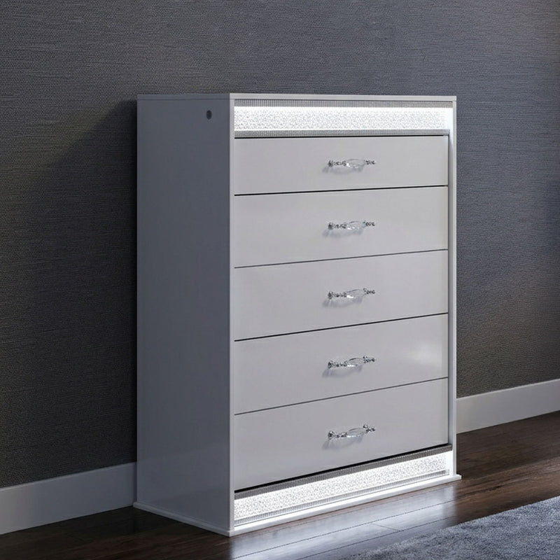White 5-drawer chest with LED light trim, angled front view on dark wall.