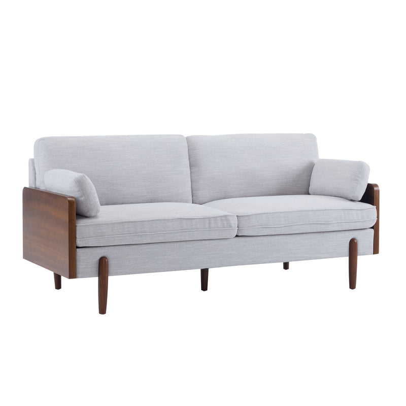 Light gray upholstered sofa with dark wood arm panels and tapered legs