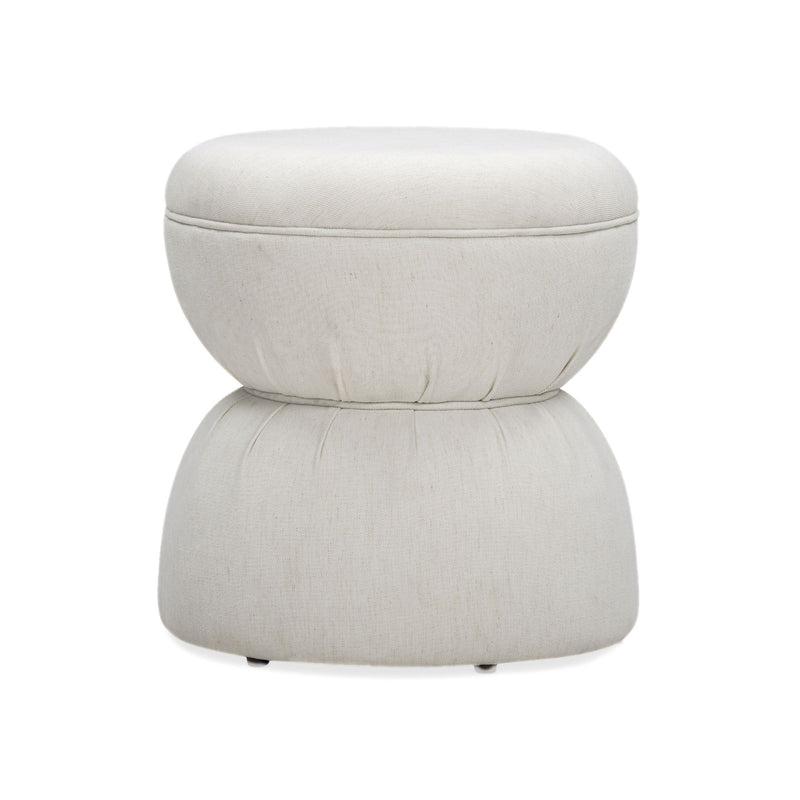 Light beige ruched upholstered ottoman with round padded top and stacked base