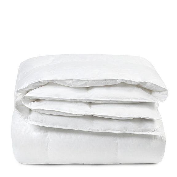 White down-alternative sham insert, folded into a compact stack with smooth fabric