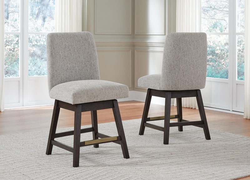 Set of 2 beige upholstered barstools with dark brown frames and tall curved backrests