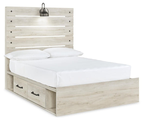 Cambeck panel bed with light wood frame, white bedding, and two front drawer drawers