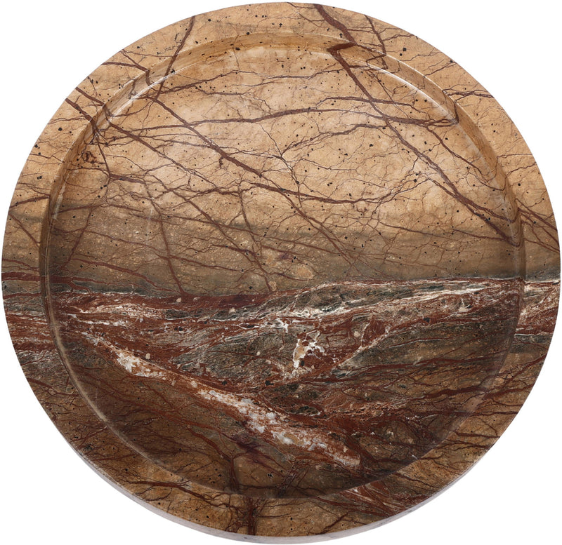 Tan marble tray with round shallow basin and red-brown and dark vein streaks