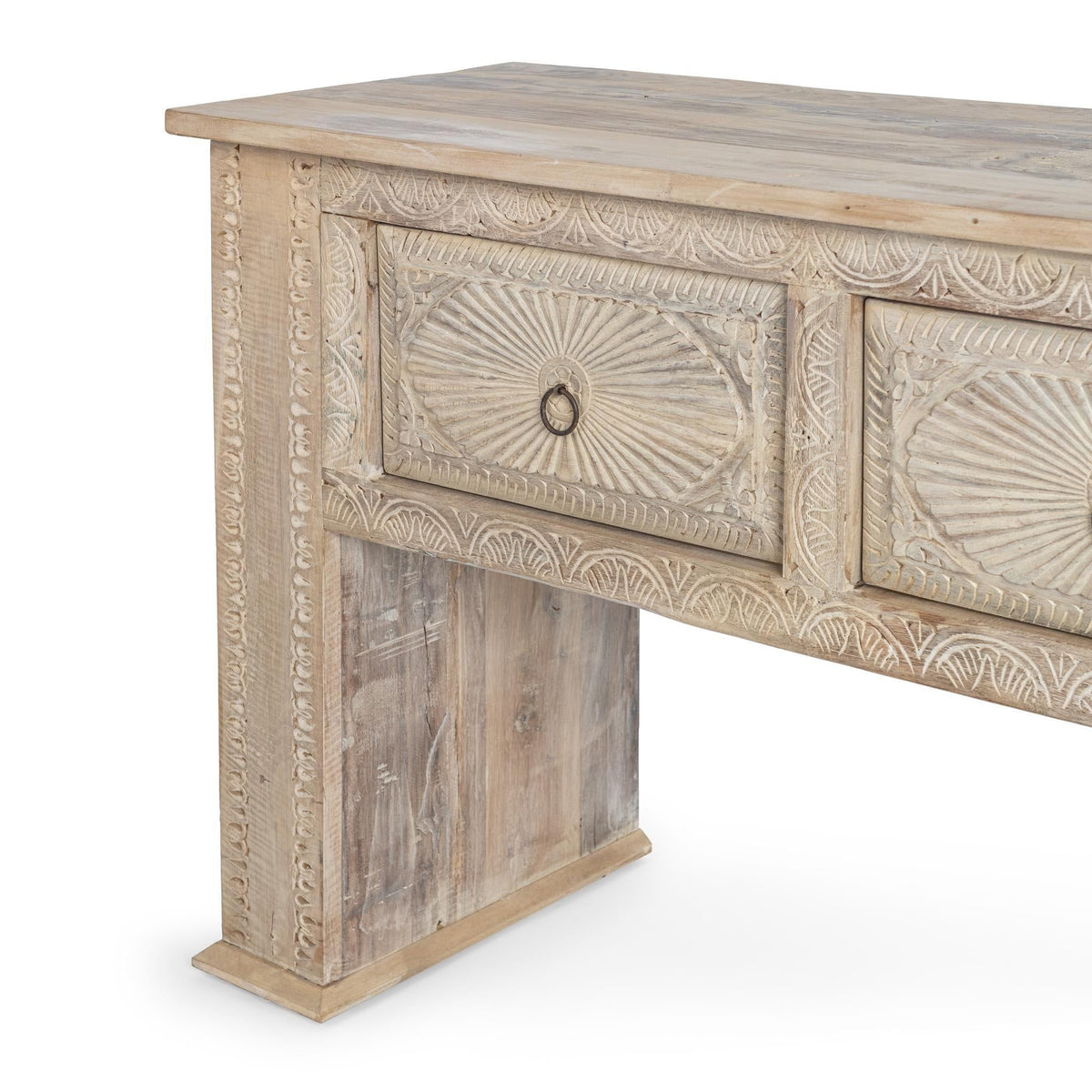 Butterwood console table close-up: carved drawer fronts with round knobs
