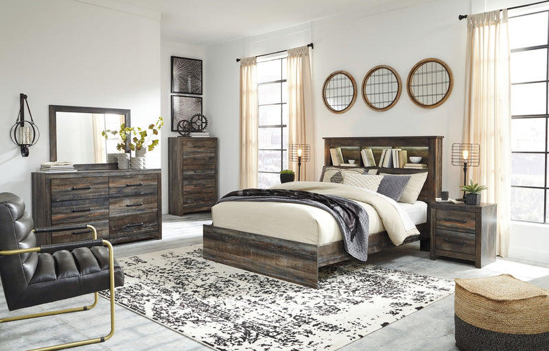 Panel bookcase bed with open-shelf headboard and side storage drawers, dark wood finish.