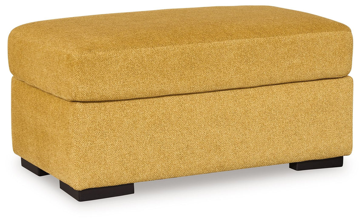 Mustard upholstered ottoman with padded top and hinged-lid style, dark legs