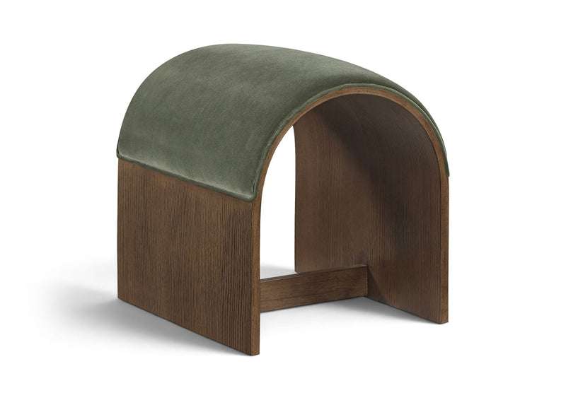 Green velvet upholstered bench with arched back and dark wood base, open center