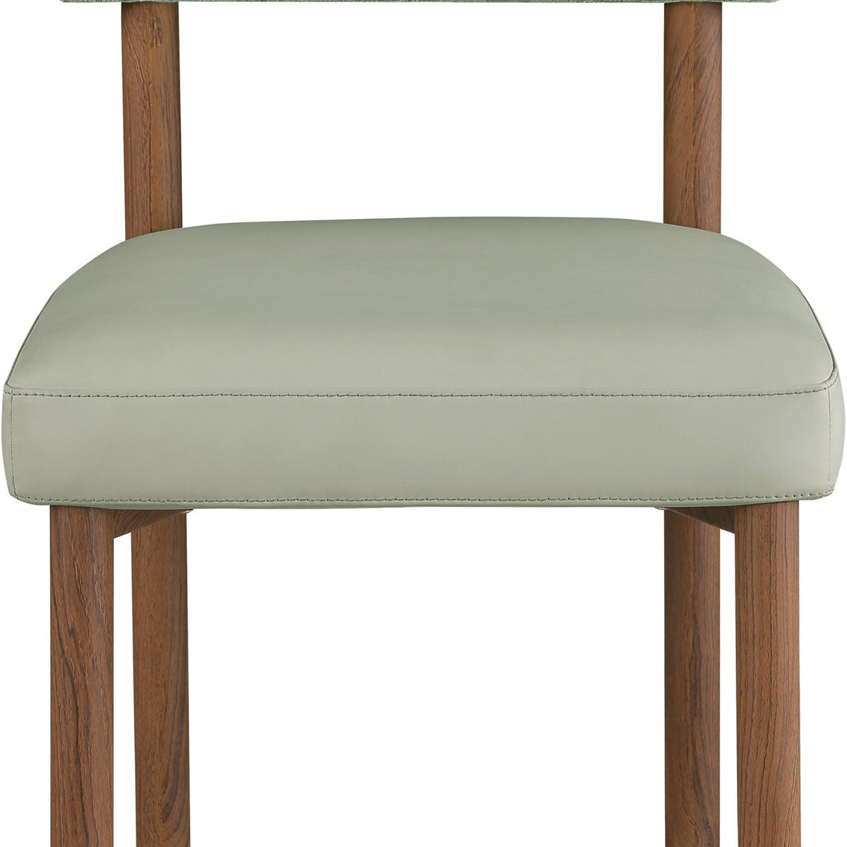 Green upholstered dining chair with chenille back and vegan leather seat, wood legs.