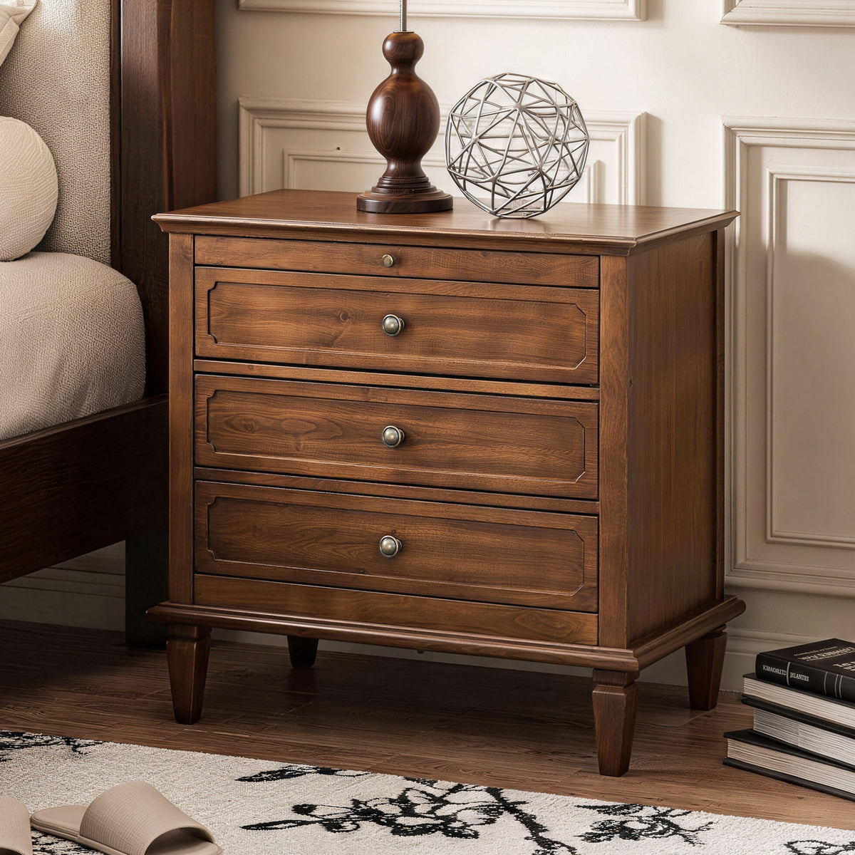 Dark brown three-drawer nightstand with brass-tone knobs and paneled sides