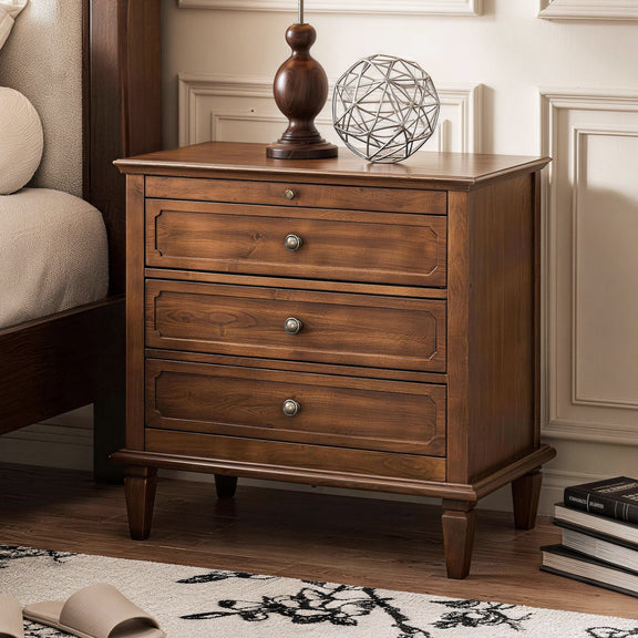 Dark brown three-drawer nightstand with brass-tone knobs and paneled sides