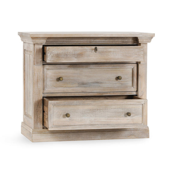 Nightstand with three cream wood drawers and round brass-tone knobs