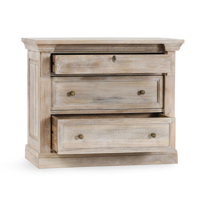 Nightstand with three cream wood drawers and round brass-tone knobs