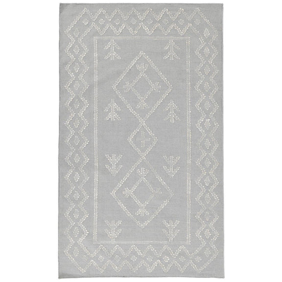 Gray rug with ornate lattice border and symmetrical diamond details throughout
