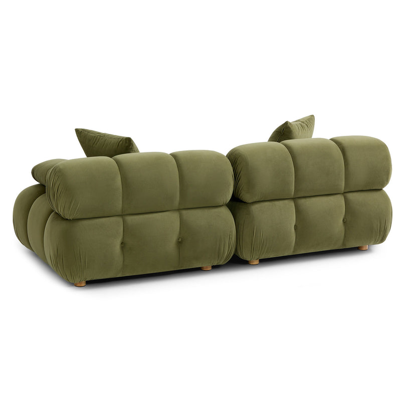 Olive green modular loveseat with tufted back, rounded arms, and two seat sections