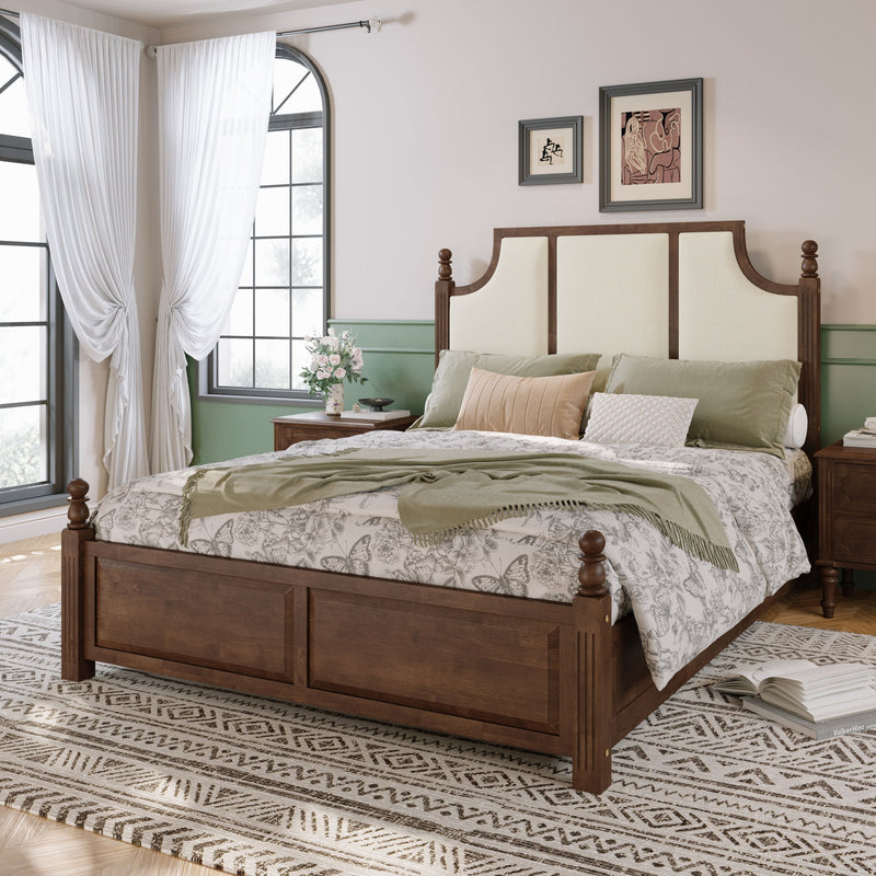 Dark brown platform bed with tall upholstered headboard and beige paneling, upholstered posts