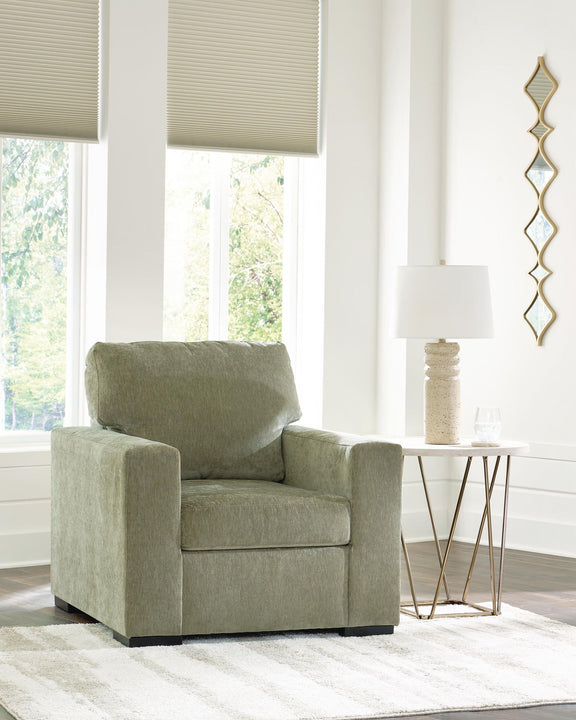 Moss green single-seat armchair with supportive seat cushion and backrest
