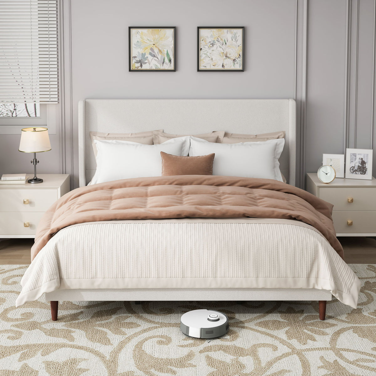 Upholstered bed with tall white headboard, white bedding, and brown quilt