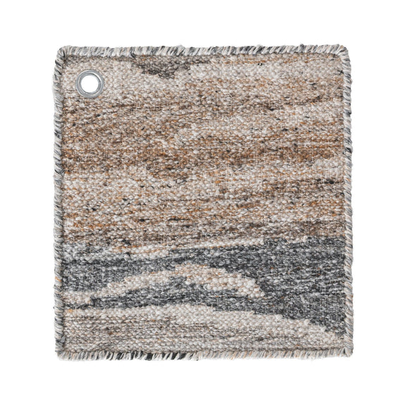 Rectangular area rug corner with braided fringe edge; beige, tan, and gray abstract weave; grommet