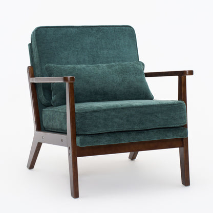 Dark green upholstered accent chair with matching lumbar pillow and dark wood arms