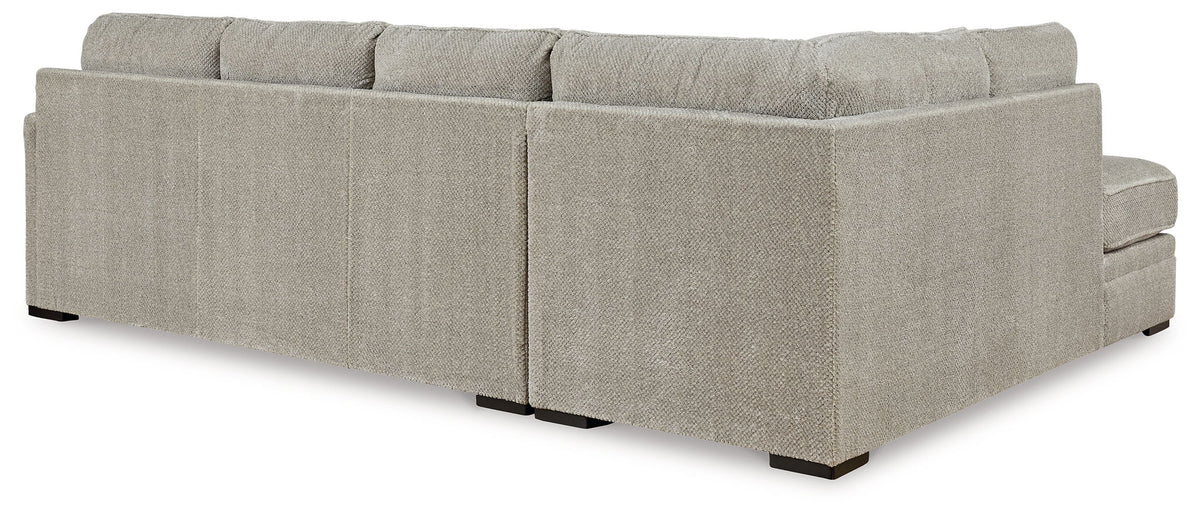 Beige corner chaise sectional sofa with rectangular arms and box seat cushions