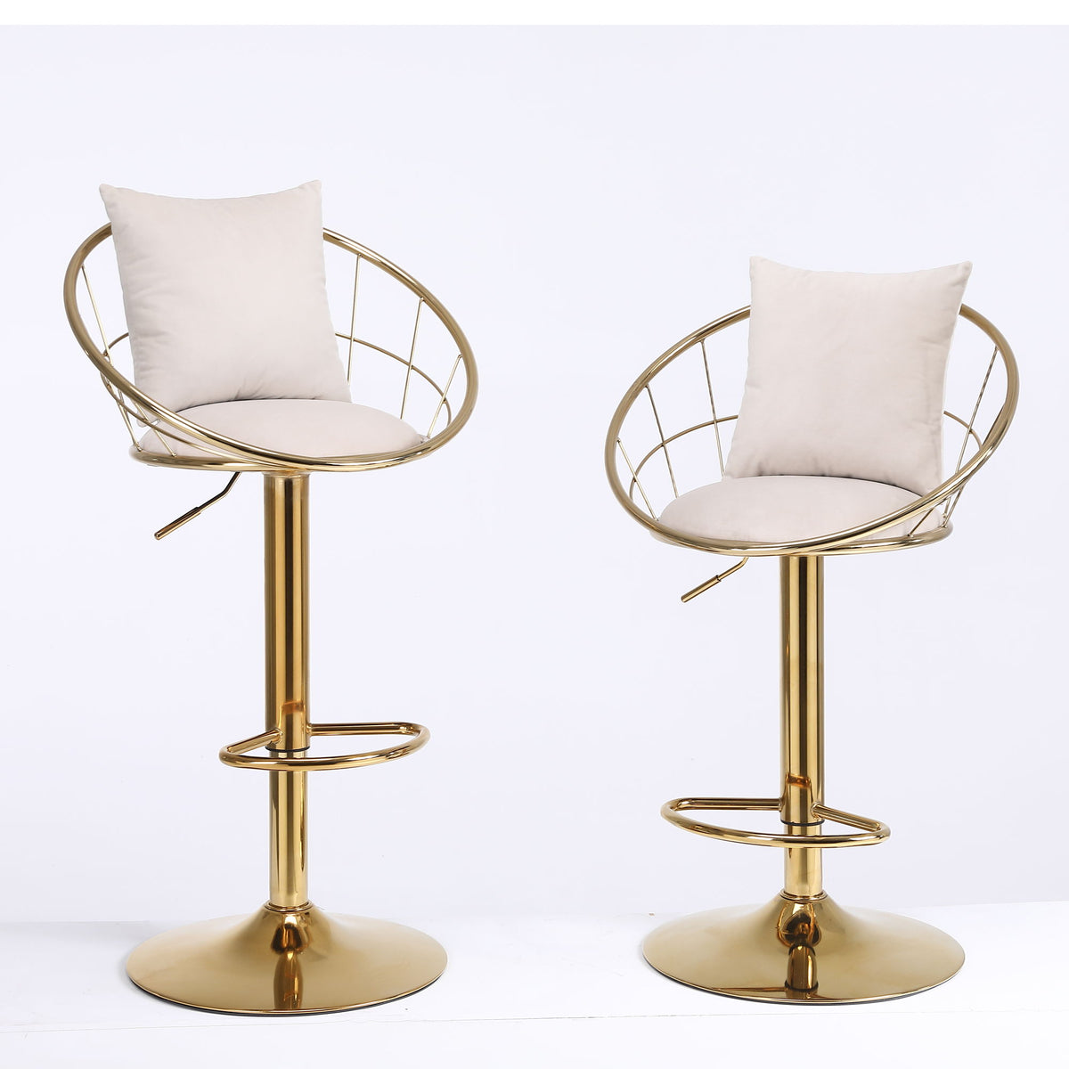 Bar chair pair with white seat cushions, gold circular base, and curved metal frame.
