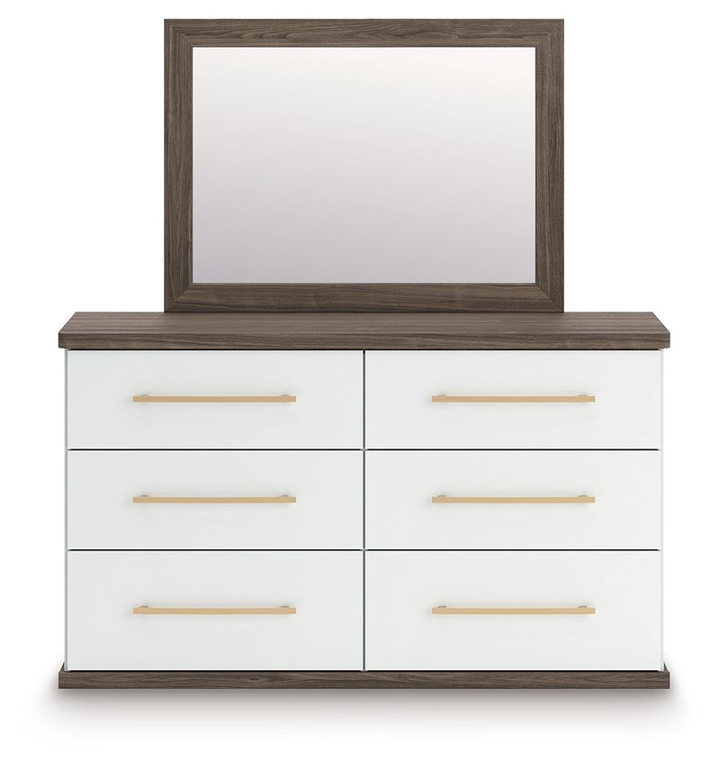 Dark wood dresser with mirror, white drawer fronts and brushed gold bar pulls