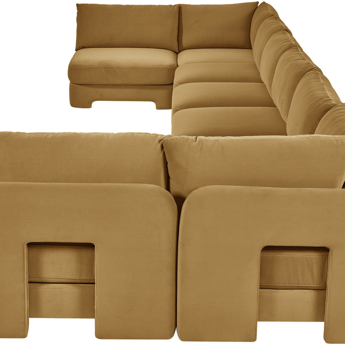 Tan velvet U-shaped armless sectional sofa with padded cushions and chaise backrests