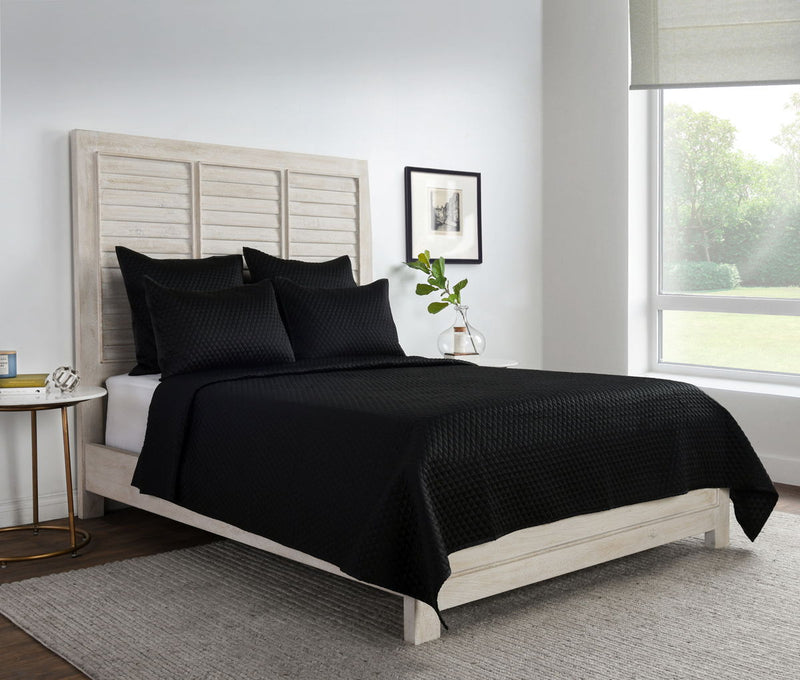 Diamond quilt set in onyx black with textured bedding and matching shams