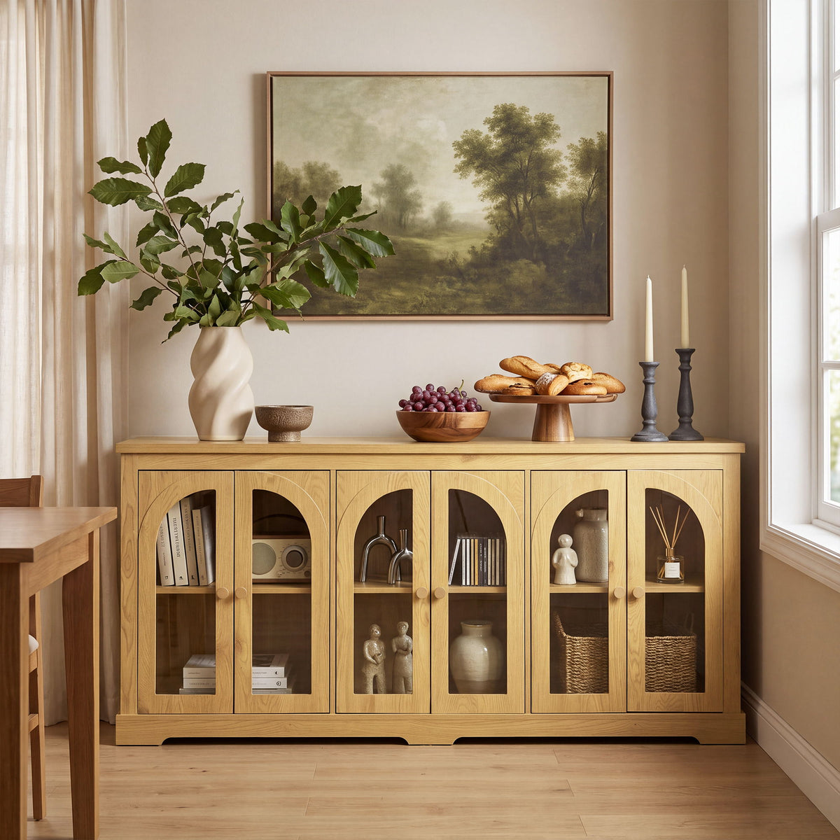 Light brown arched glass sideboard with 6 doors and brass knobs, shown in living room