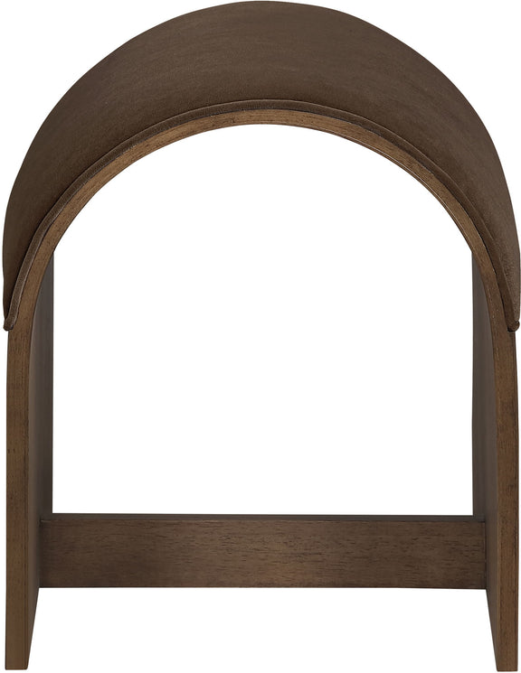 Dark brown velvet upholstered bench end with arched top and dark wood frame