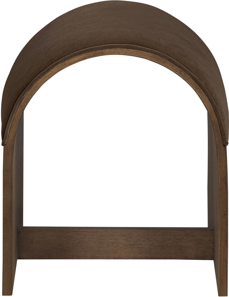 Dark brown velvet upholstered bench end with arched top and dark wood frame