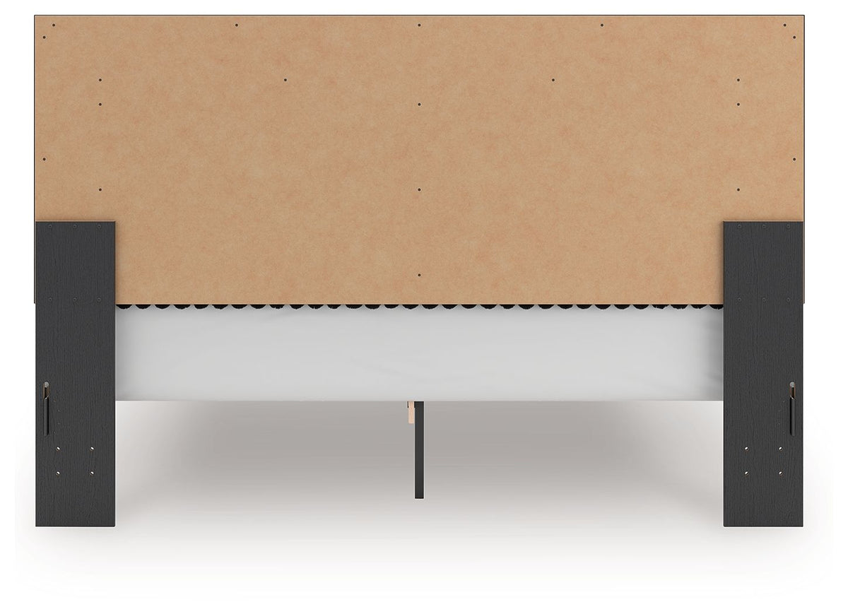 Upholstered platform bed underside view with roll slat support rails and dark legs