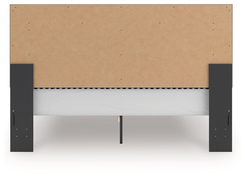 Upholstered platform bed underside view with roll slat support rails and dark legs
