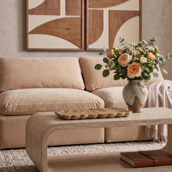 Sandstone tray on coffee table with a floral bouquet and vase