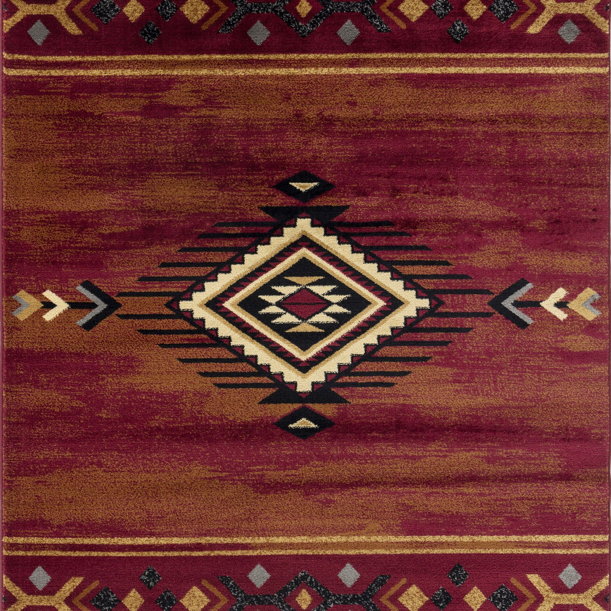Southwest area rug in deep red with multicolor geometric border and center diamond medallion.