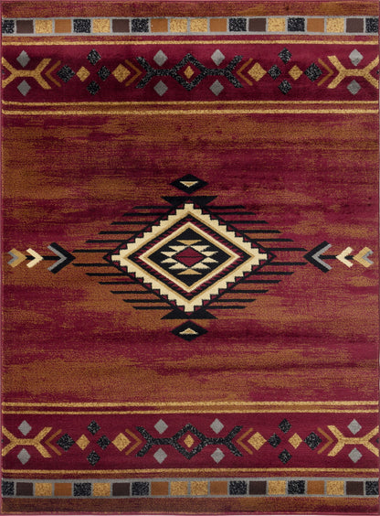 Southwest area rug close-up with red background and central diamond pattern