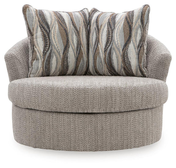 Gray swivel accent chair with textured upholstery and two striped accent pillows