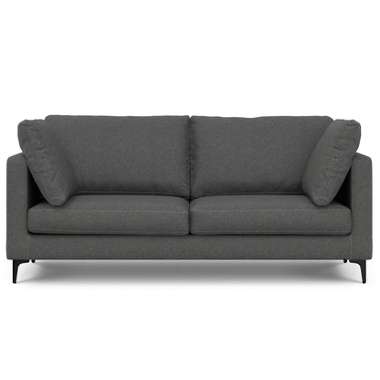 Dark gray mid-century upholstered sofa with two seat cushions and rolled armrests.