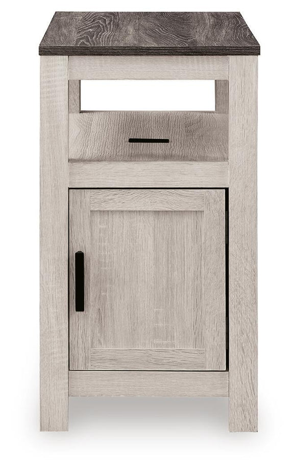 Chair side end table in whitewashed wood with open shelf and cabinet door