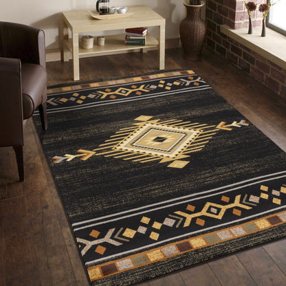 Southwest area rug in dark tones with gold geometric border and central diamond medallion.