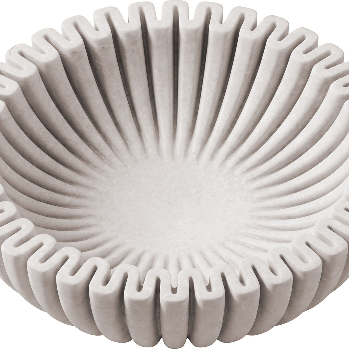 Large decorative bowl, view from above, concentric ridges on light gray surface.